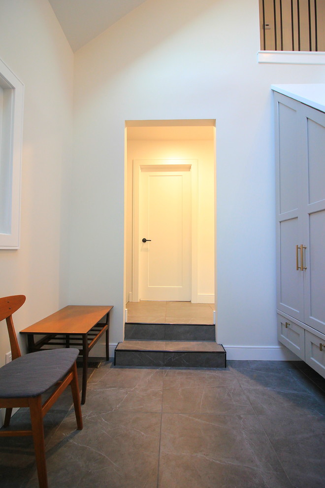 Example of a large transitional wooden l-shaped mixed material railing home design design with painted risers