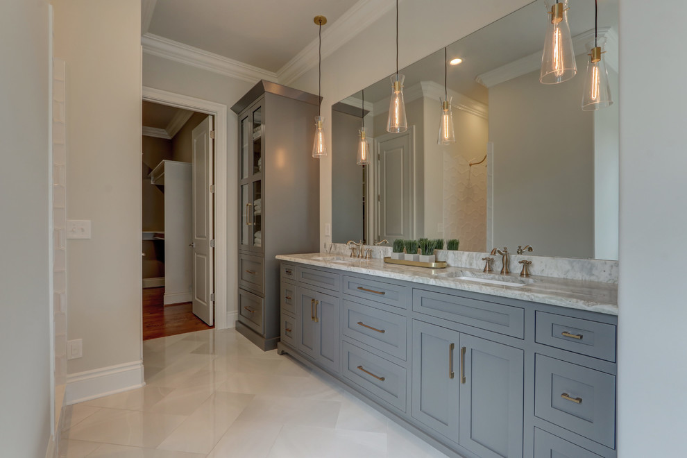 Inspiration for a large traditional master bathroom in Other with recessed-panel cabinets, porcelain floors, an undermount sink, marble benchtops, green benchtops and grey cabinets.