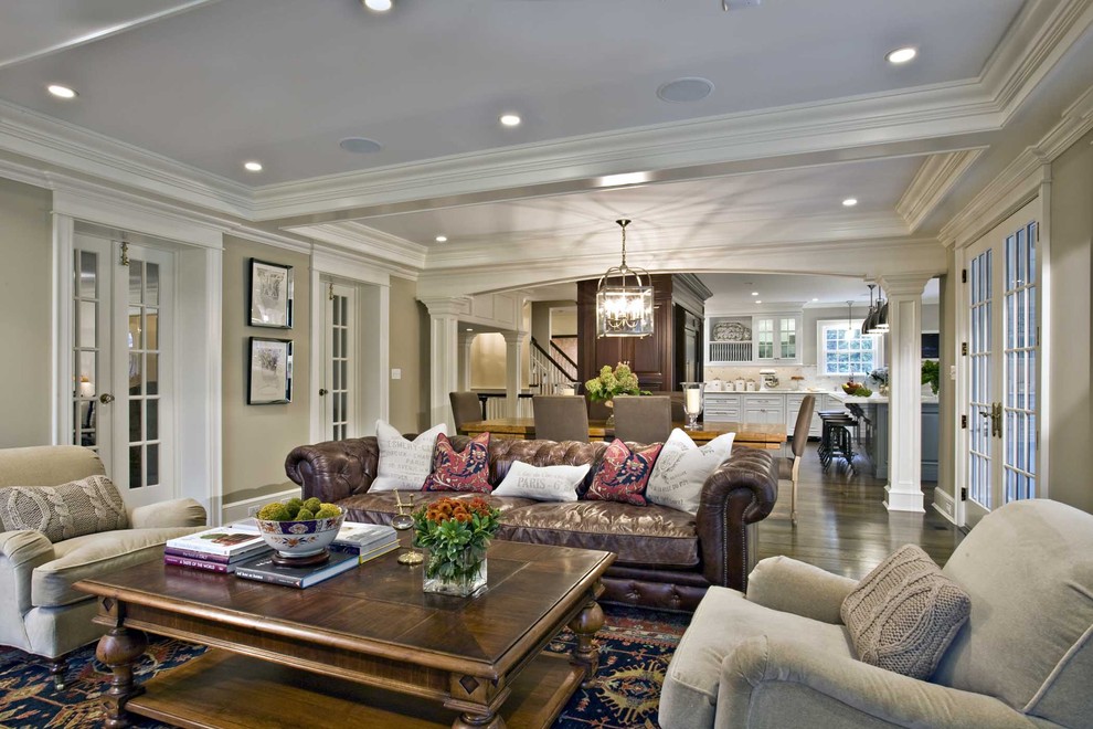 Photo of a mid-sized traditional open concept living room in New York with grey walls and dark hardwood floors.