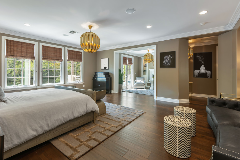 Inspiration for a large contemporary master bedroom in Los Angeles with grey walls, dark hardwood floors and brown floor.