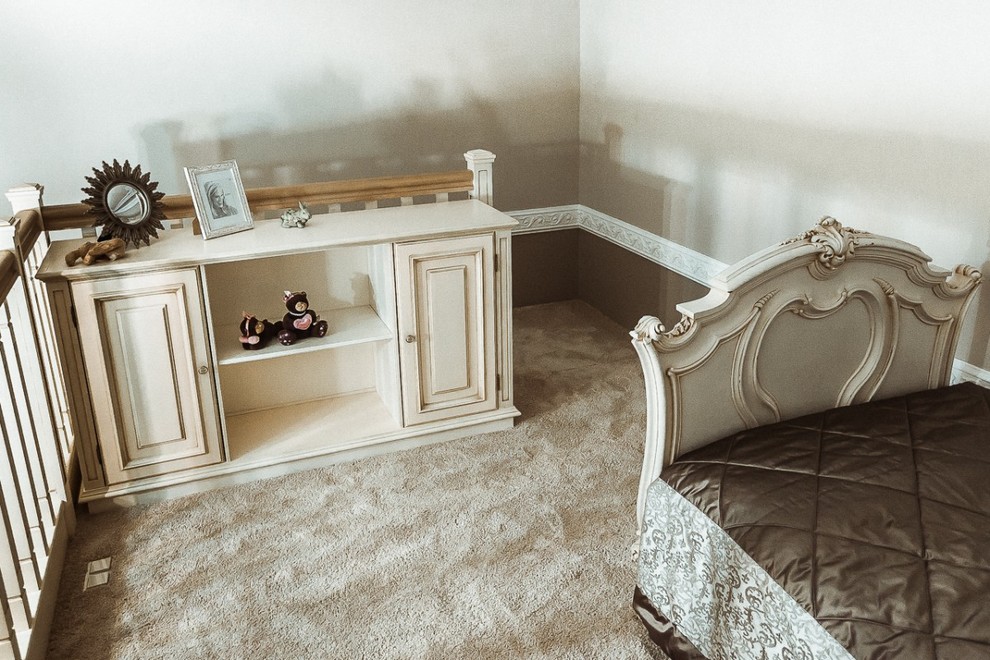 Photo of a mid-sized traditional toddler room in Saint Petersburg with medium hardwood floors.