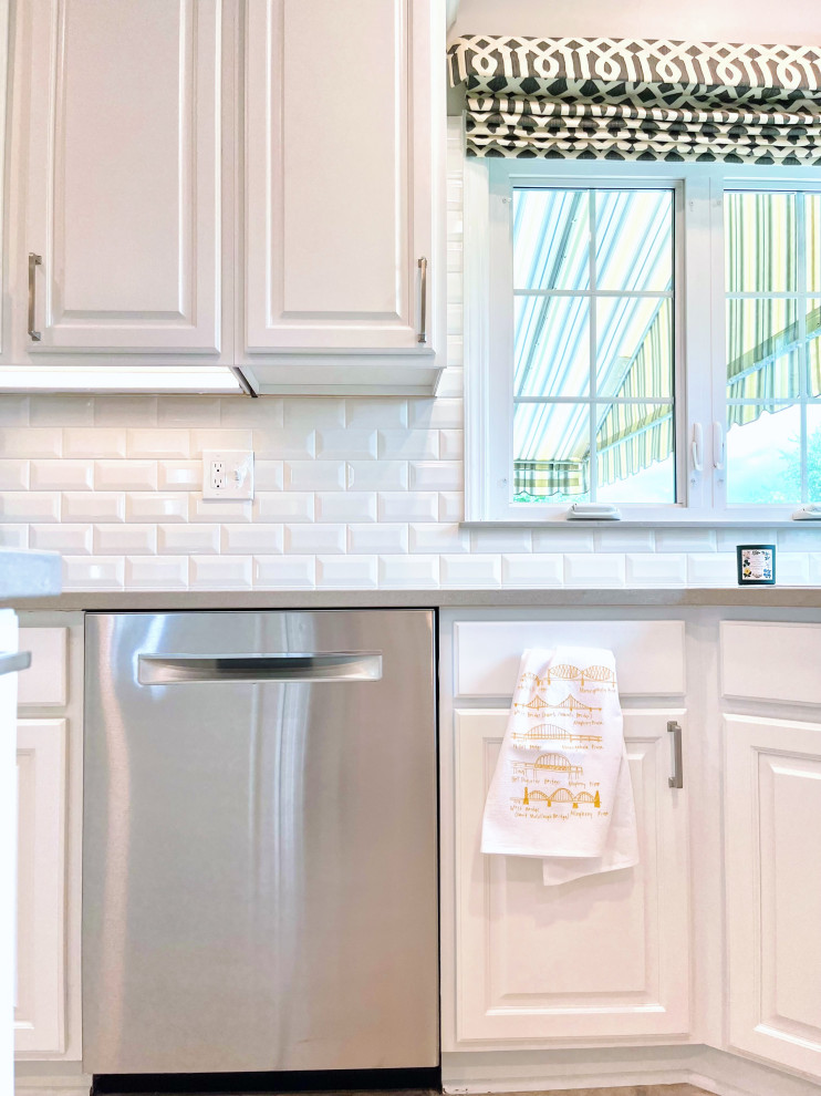 Inspiration for a large transitional u-shaped ceramic tile and beige floor open concept kitchen remodel with an undermount sink, recessed-panel cabinets, white cabinets, quartz countertops, white backsplash, ceramic backsplash, stainless steel appliances, an island and gray countertops