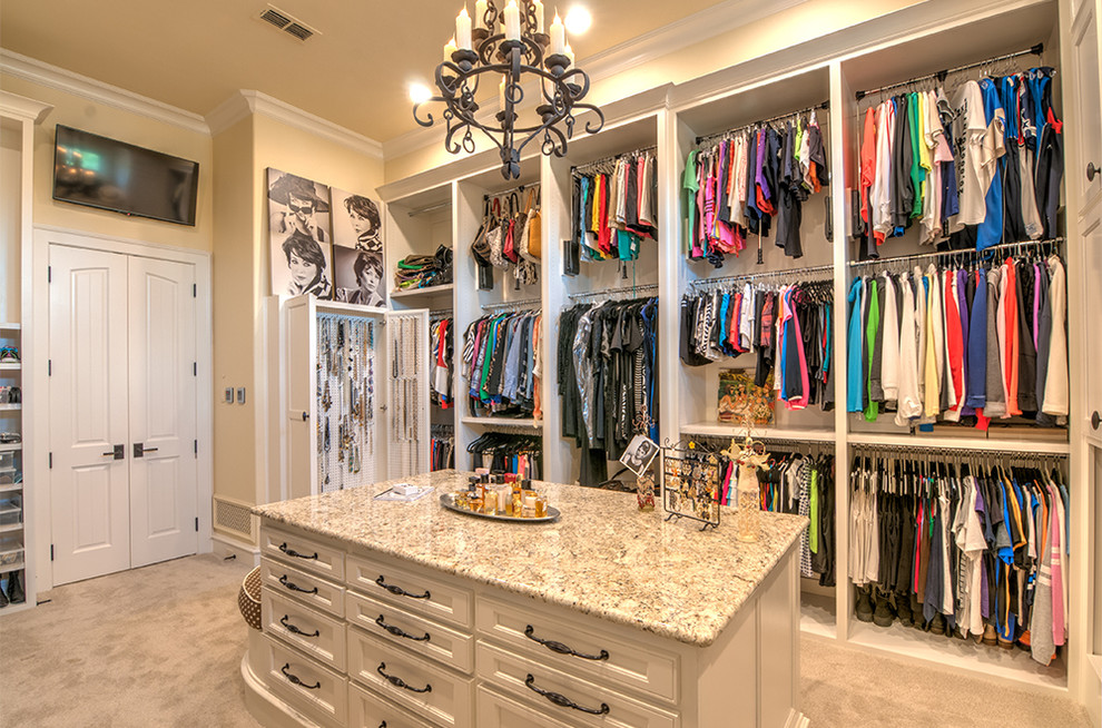 Design ideas for an expansive traditional women's walk-in wardrobe in Dallas with white cabinets, carpet and recessed-panel cabinets.