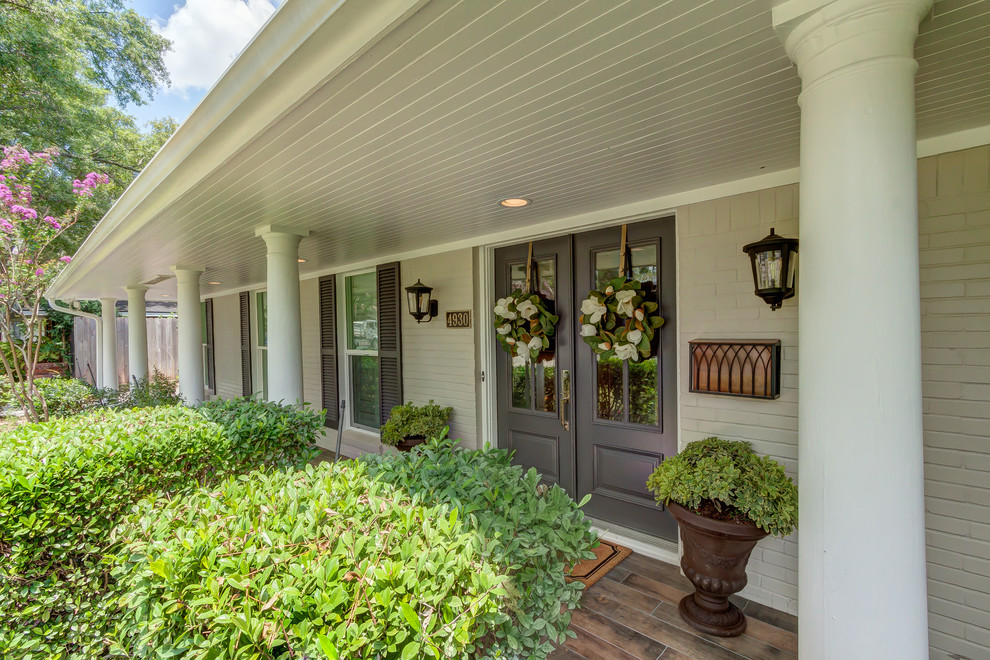 Transitional gray two-story gable roof idea in Houston with a shingle roof