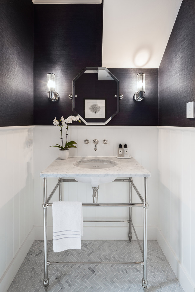 Inspiration for a small transitional powder room in Auckland with open cabinets, a wall-mount toilet, white tile, marble, grey walls, marble floors, an undermount sink, marble benchtops and grey floor.