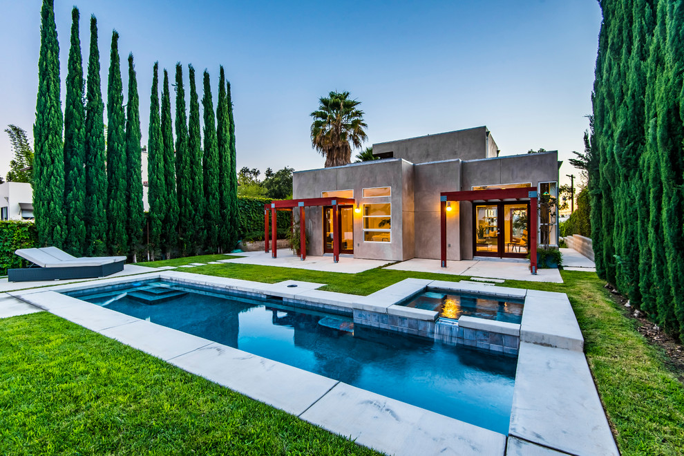 Photo of a contemporary backyard rectangular lap pool in Los Angeles with a hot tub.