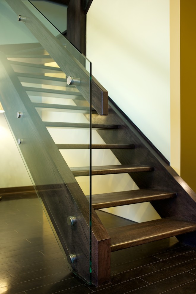 Inspiration for a modern wood u-shaped staircase in Edmonton with open risers.