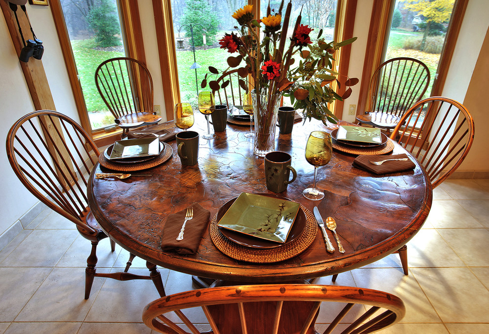 Kitchen/dining room combo - mid-sized rustic ceramic tile and beige floor kitchen/dining room combo idea in Baltimore with beige walls