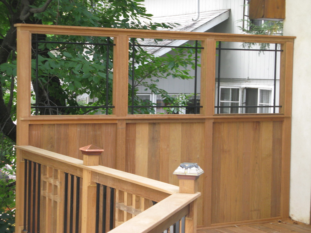 This is an example of a small arts and crafts backyard deck in New York with no cover.