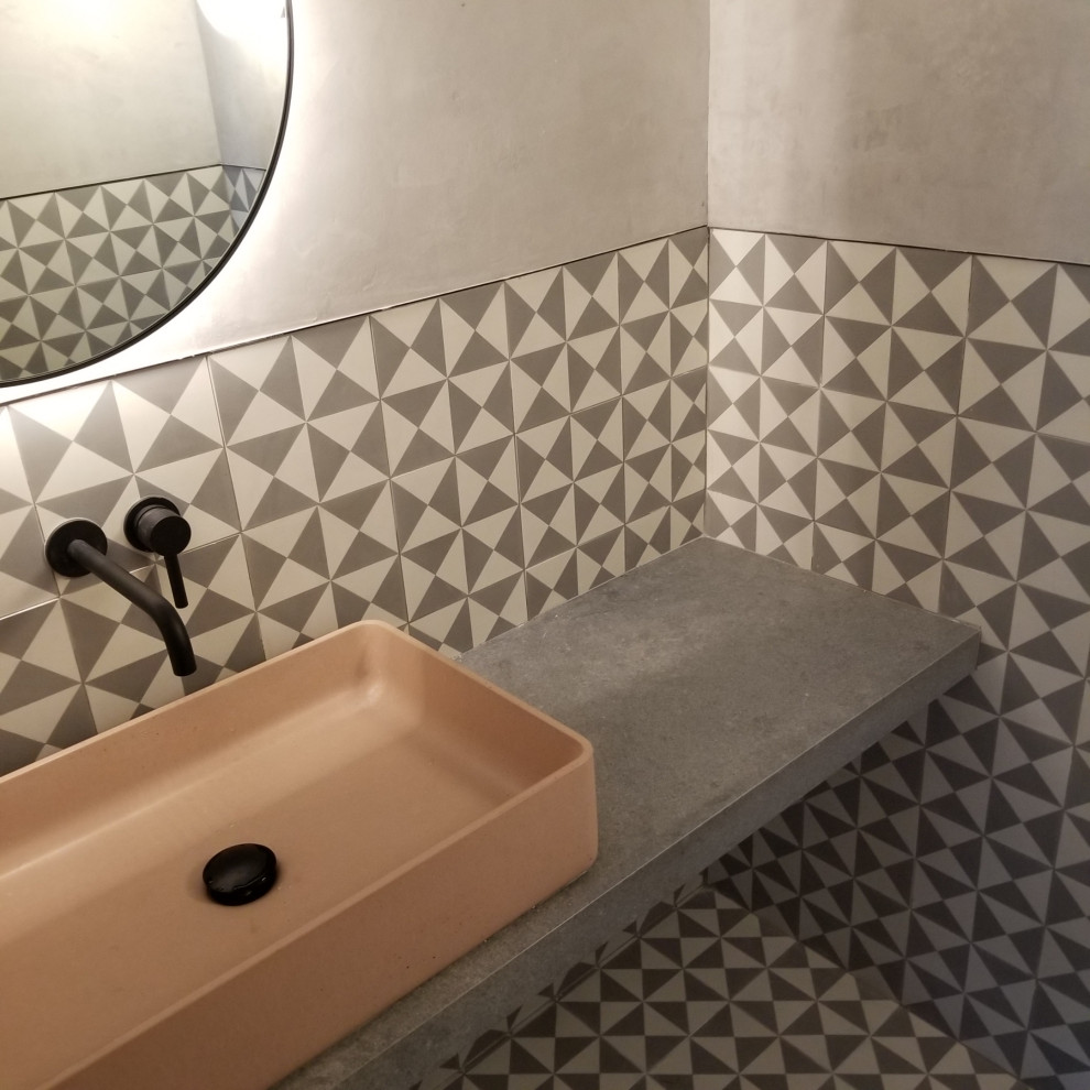 Design ideas for a small modern powder room in Philadelphia with open cabinets, grey cabinets, a one-piece toilet, black and white tile, cement tile, grey walls, cement tiles, a vessel sink, concrete benchtops, grey floor, grey benchtops and a built-in vanity.