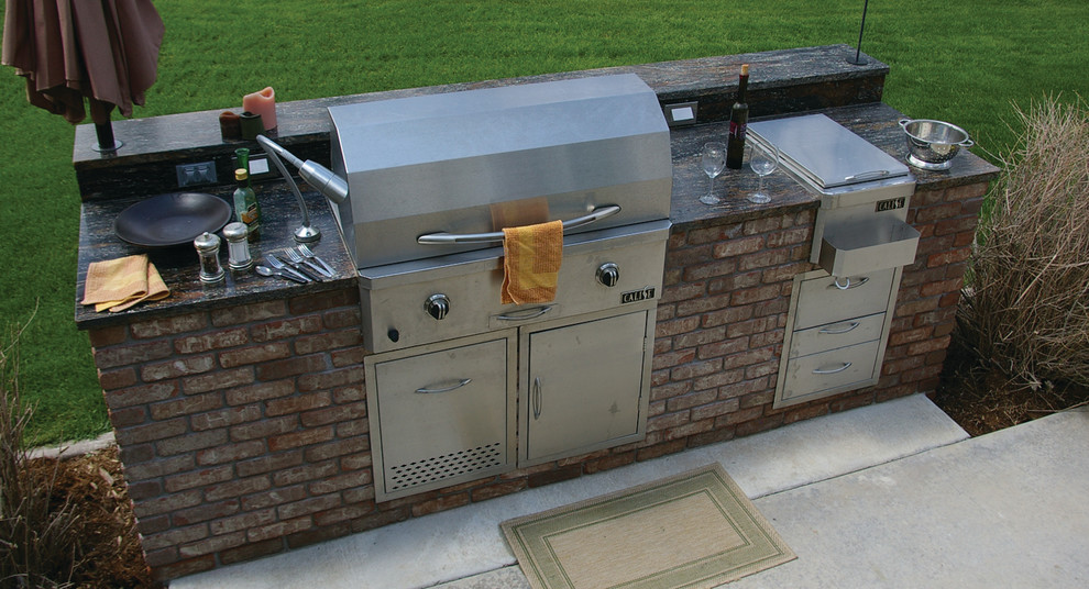 Inspiration for a mid-sized backyard landscaping in Denver with a fire pit.