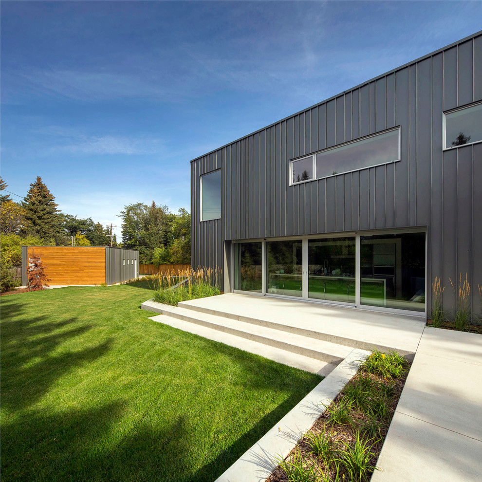 Photo of a contemporary exterior in Edmonton with metal siding.