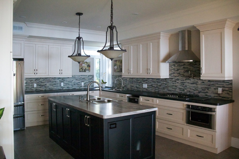 Example of a transitional ceramic tile kitchen design in Toronto with laminate countertops, gray backsplash, stainless steel appliances and an island