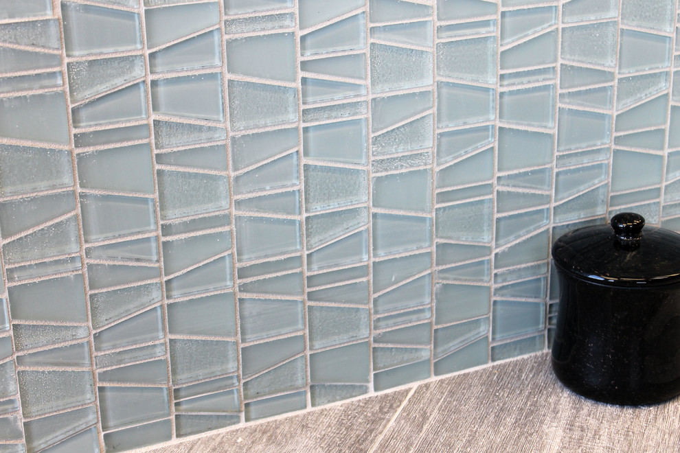 Small kitchen photo in New York with blue backsplash and glass tile backsplash