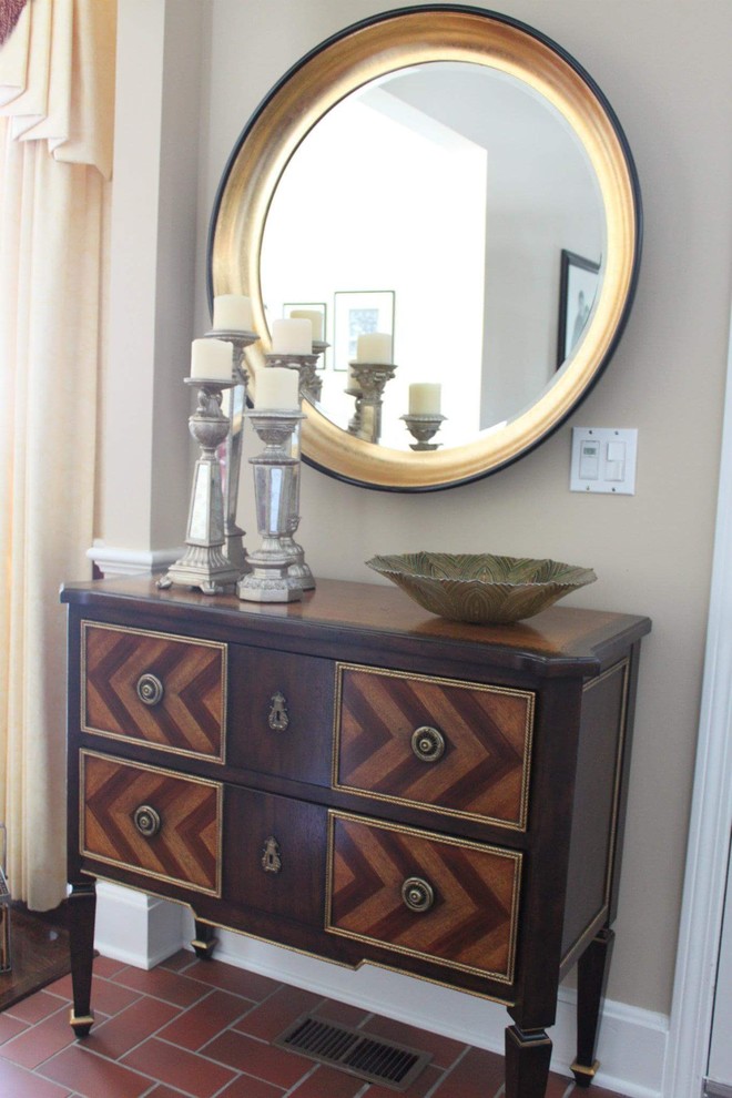 Small transitional terra-cotta tile entry hall photo in Chicago with beige walls and a dark wood front door