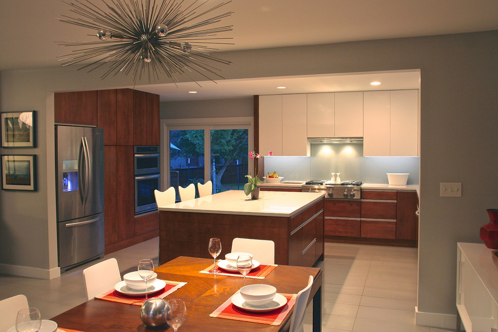 Inspiration for a mid-sized modern u-shaped ceramic tile eat-in kitchen remodel in Other with an undermount sink, flat-panel cabinets, medium tone wood cabinets, quartz countertops, gray backsplash, glass sheet backsplash, stainless steel appliances and an island