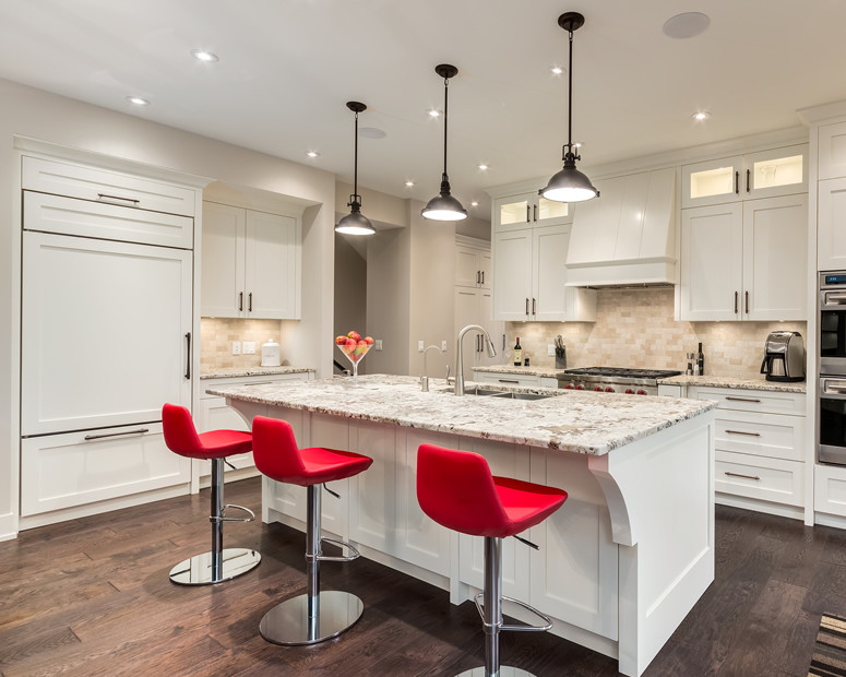 Inspiration for a large transitional single-wall dark wood floor and brown floor enclosed kitchen remodel in Calgary with an undermount sink, shaker cabinets, white cabinets, granite countertops, beige backsplash, porcelain backsplash, stainless steel appliances and an island