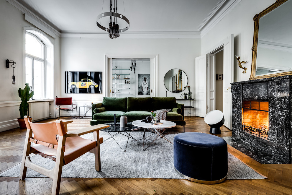Medium sized scandinavian living room in London with medium hardwood flooring, a standard fireplace, a stone fireplace surround and beige floors.