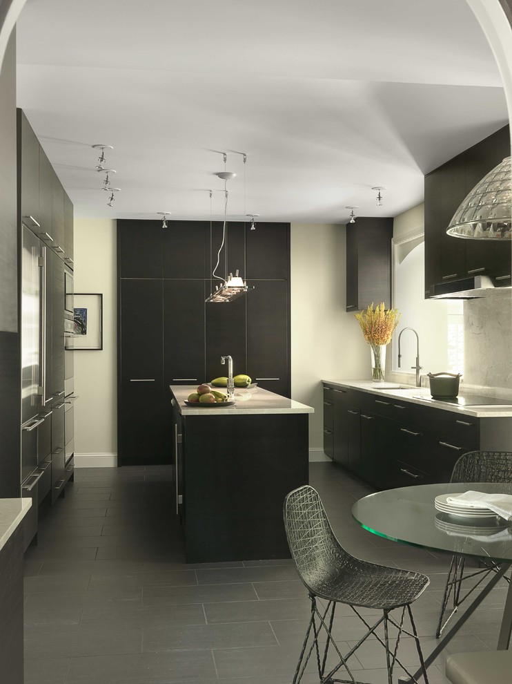 Design ideas for a mid-sized contemporary u-shaped eat-in kitchen in St Louis with flat-panel cabinets, black cabinets, white splashback, stone slab splashback, an undermount sink, stainless steel appliances, with island, grey floor, limestone benchtops and ceramic floors.