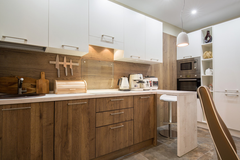 Mid-sized contemporary l-shaped eat-in kitchen in Other with medium wood cabinets, solid surface benchtops, brown splashback, timber splashback, stainless steel appliances, porcelain floors, no island, a drop-in sink, flat-panel cabinets and brown floor.