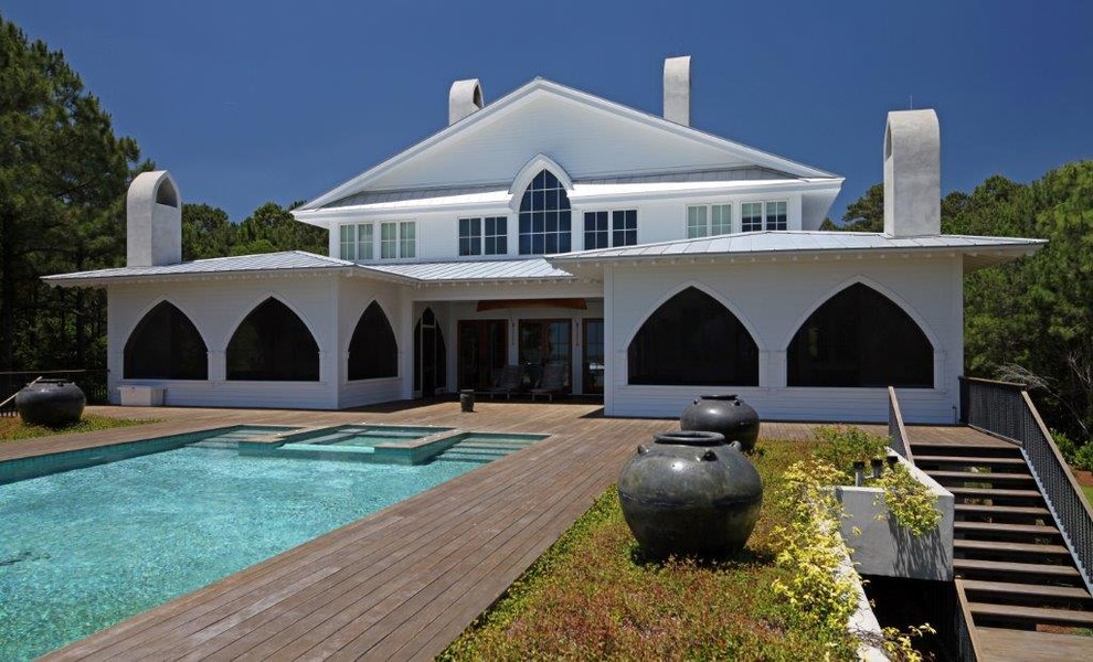 Hot tub - mid-sized contemporary backyard rectangular infinity hot tub idea in Charleston with decking