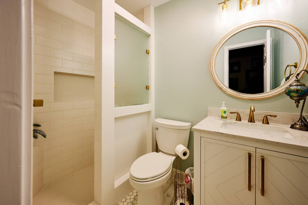 Bathroom - large country kids' white tile and ceramic tile ceramic tile, brown floor and single-sink bathroom idea in Houston with shaker cabinets, white cabinets, a two-piece toilet, green walls, an undermount sink, white countertops, a niche and a freestanding vanity