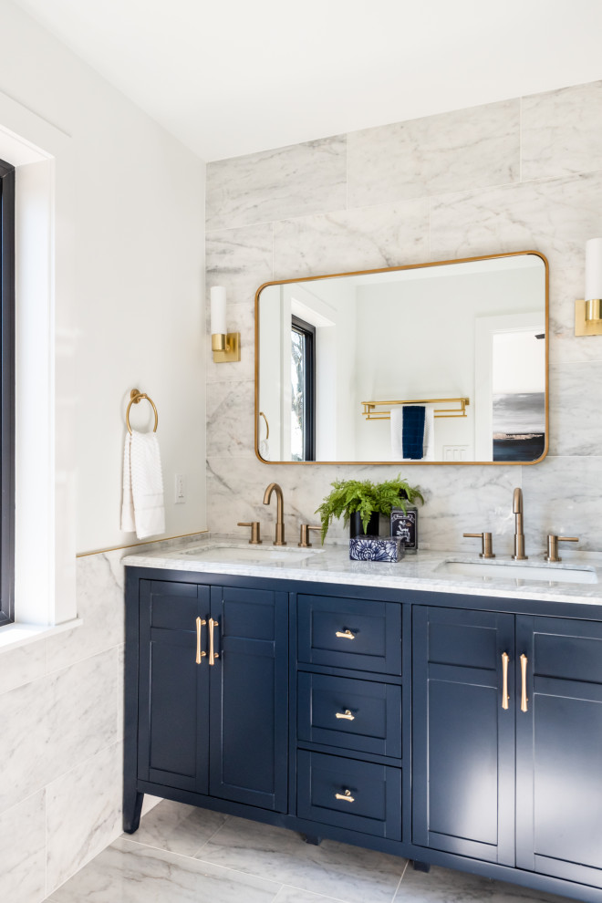Design ideas for a mid-sized modern master bathroom in DC Metro with shaker cabinets, blue cabinets, an alcove shower, a one-piece toilet, white tile, marble, white walls, marble floors, a console sink, granite benchtops, white floor, a sliding shower screen, white benchtops, a niche, a single vanity and a built-in vanity.