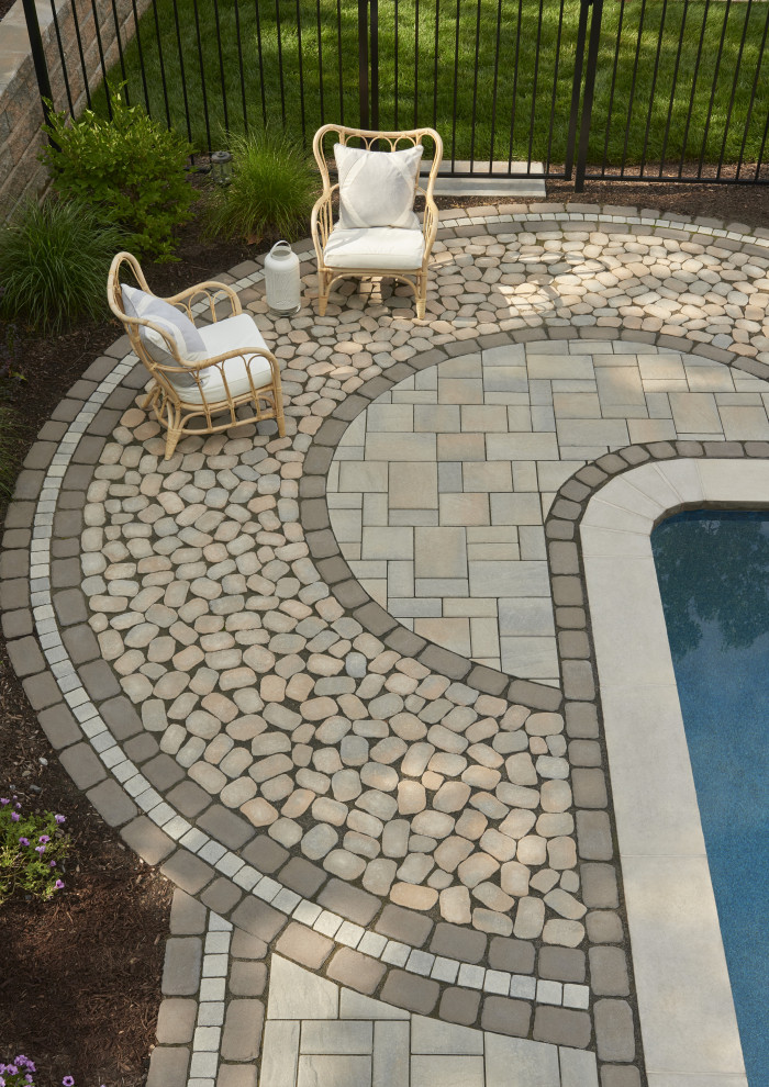 This is an example of a traditional backyard garden in Philadelphia with concrete pavers.
