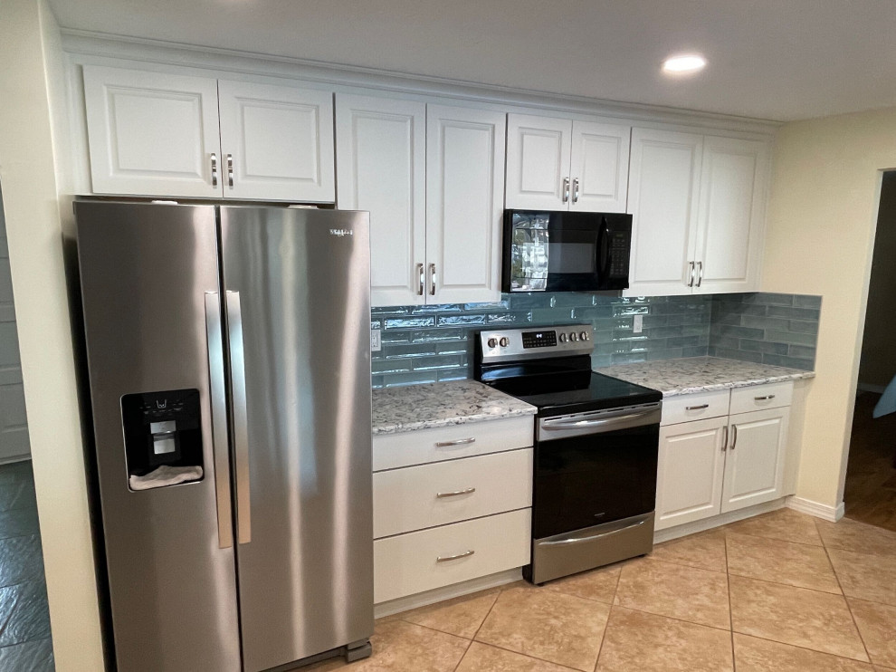 Photo of a mid-sized transitional eat-in kitchen in Tampa with shaker cabinets, white cabinets, quartz benchtops, blue splashback and ceramic splashback.