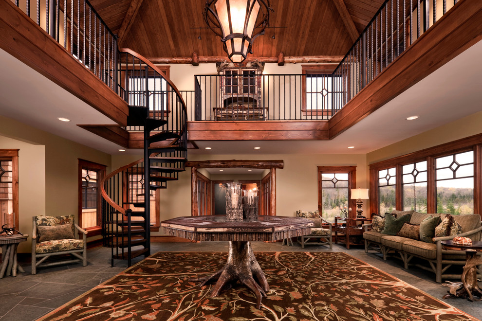 Inspiration for a country foyer in Other with beige walls and granite floors.
