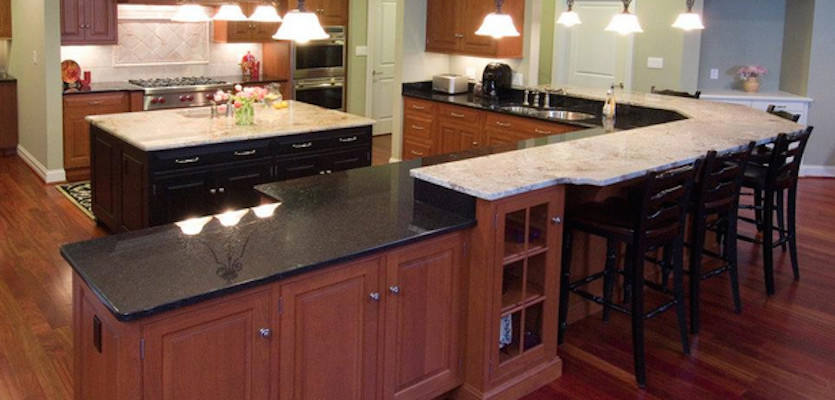 Inspiration for a medium tone wood floor eat-in kitchen remodel with a double-bowl sink, beaded inset cabinets, medium tone wood cabinets, granite countertops, white backsplash, stainless steel appliances and an island