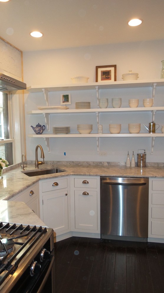 Example of a mid-sized transitional l-shaped dark wood floor and brown floor enclosed kitchen design in Chicago with beaded inset cabinets, white cabinets, granite countertops, a single-bowl sink, stainless steel appliances and no island