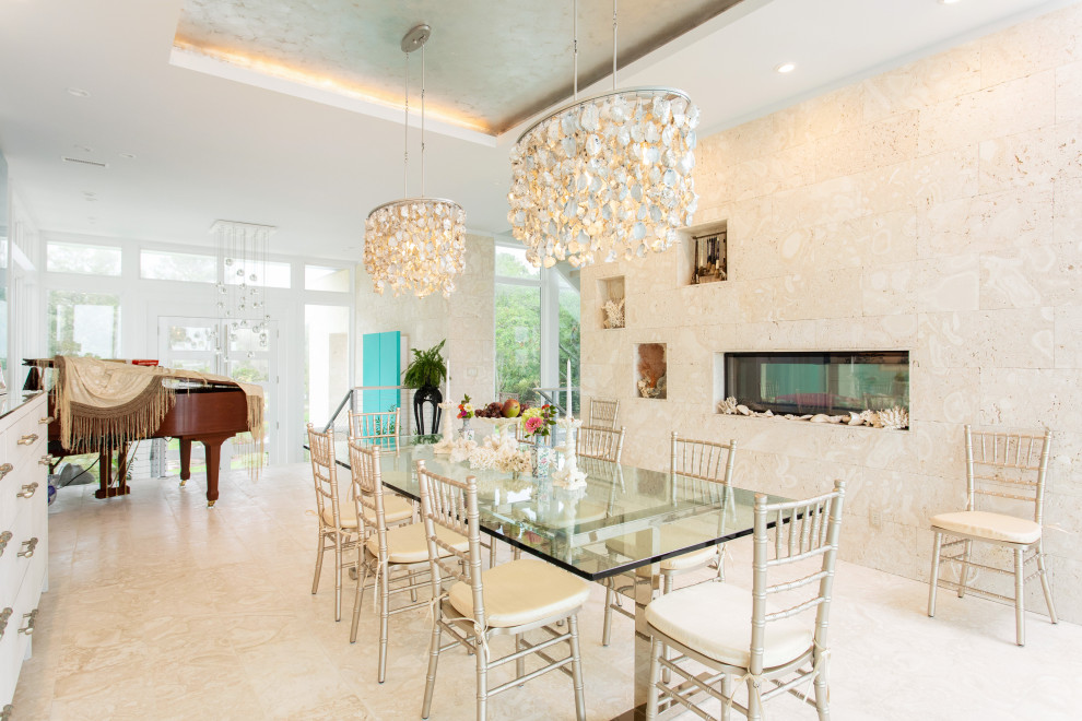 Large eclectic separate dining room in Other with beige walls, limestone floors, a two-sided fireplace, beige floor and recessed.