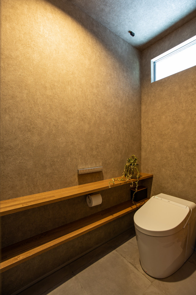This is an example of a contemporary powder room in Nagoya.