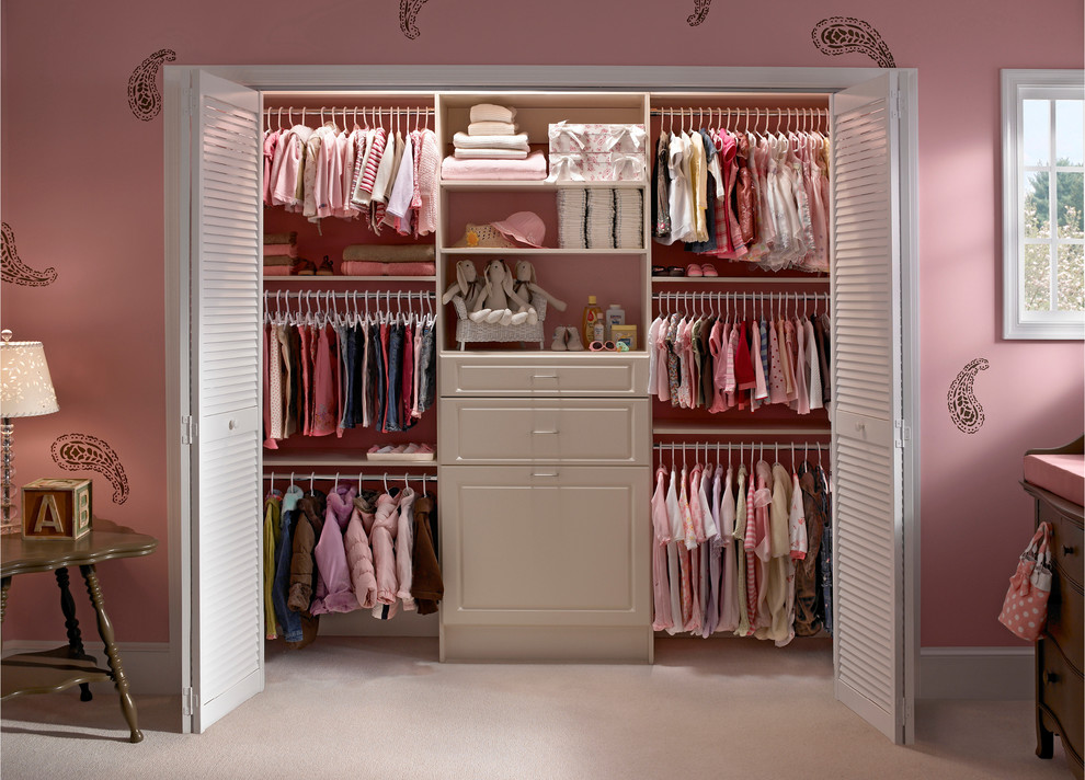 Inspiration for a small contemporary women's built-in wardrobe in Boston with raised-panel cabinets, white cabinets and carpet.