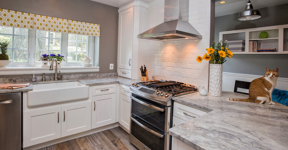 Inspiration for a transitional kitchen in Philadelphia with a farmhouse sink, white cabinets, granite benchtops, white splashback, stainless steel appliances, ceramic floors and no island.