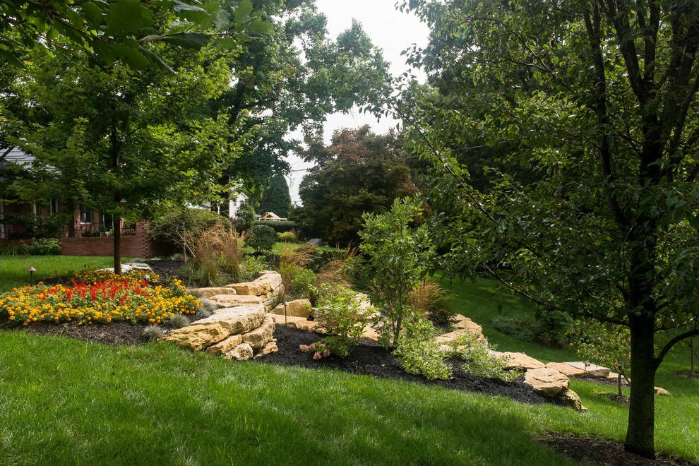 Design ideas for a large traditional backyard full sun garden for summer in Columbus with a garden path and natural stone pavers.
