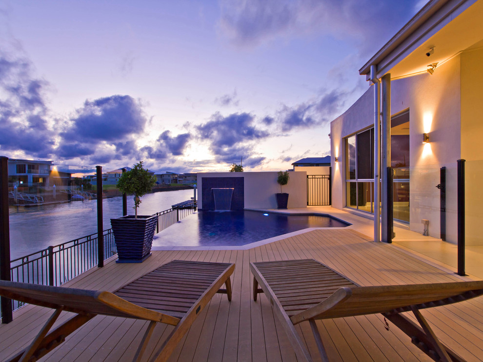 Photo of a small modern indoor custom-shaped indoor pool in Brisbane with decking.