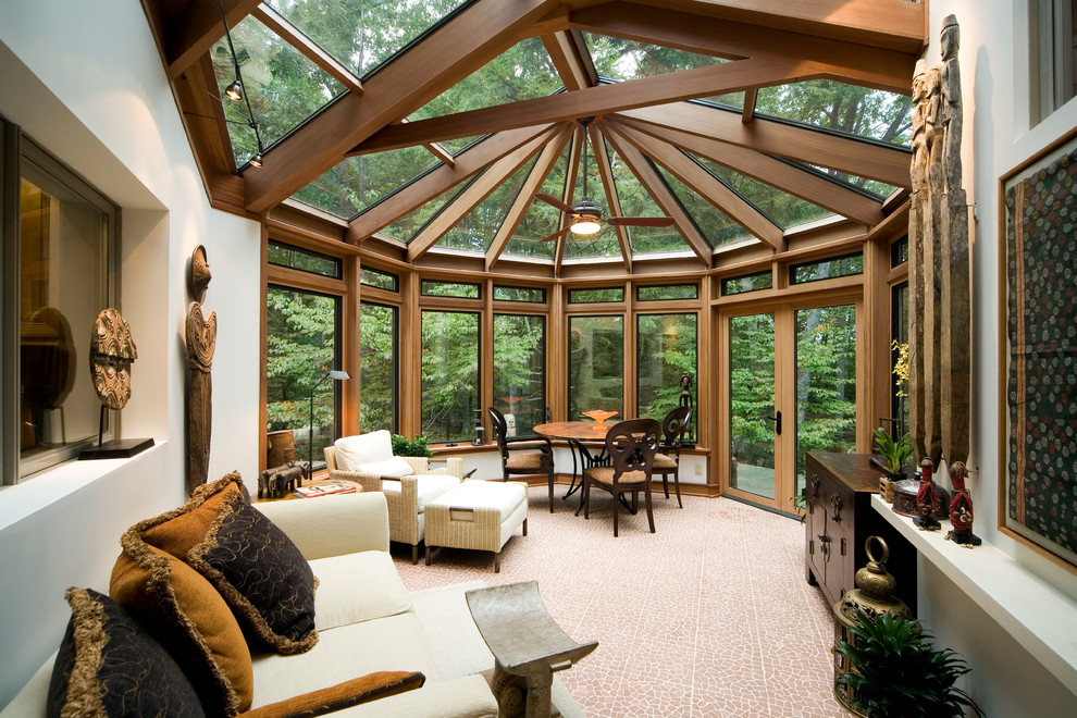 This is an example of a traditional sunroom in DC Metro with no fireplace and a glass ceiling.