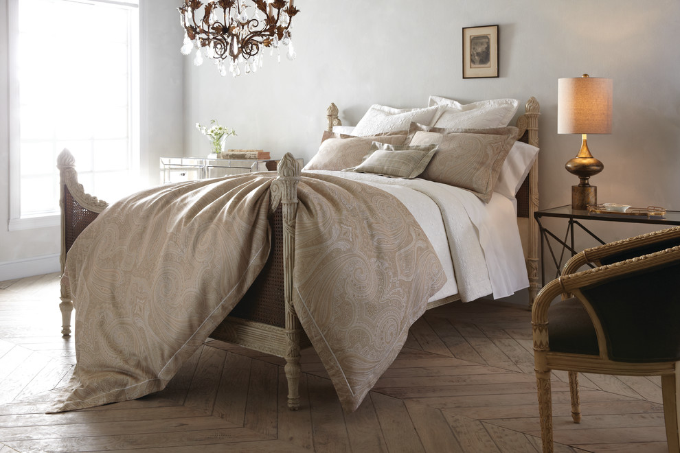 Inspiration for a mid-sized transitional master light wood floor bedroom remodel with gray walls