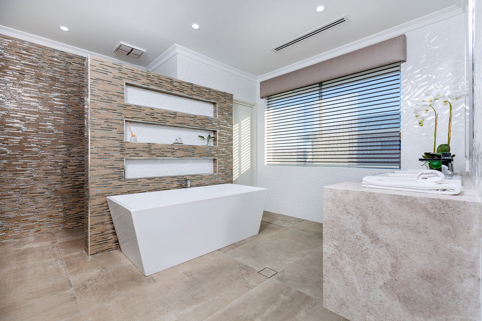 This is an example of a large contemporary master bathroom in Perth with flat-panel cabinets, beige cabinets, a freestanding tub, an open shower, a two-piece toilet, white tile, ceramic tile, white walls, ceramic floors, a drop-in sink, granite benchtops, beige floor, beige benchtops, an enclosed toilet, a double vanity and a built-in vanity.