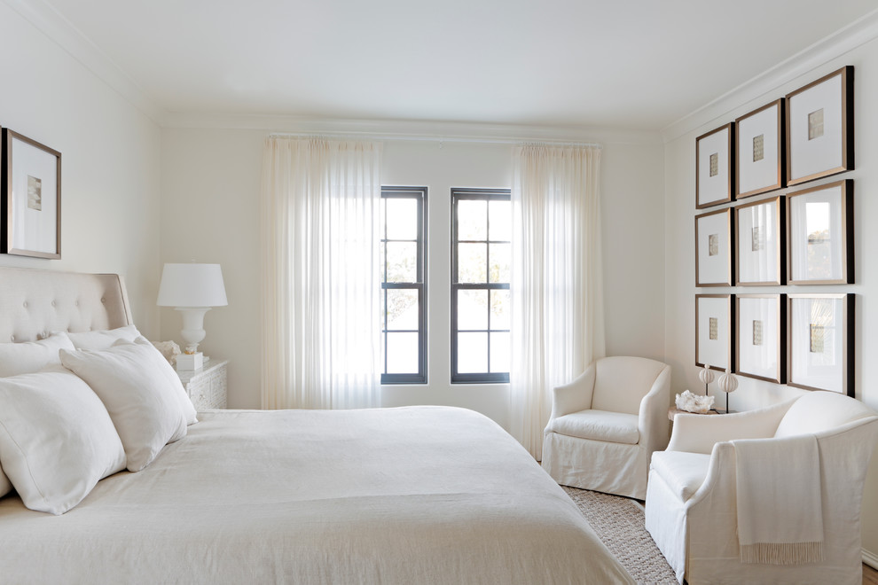 Beach style master bedroom in Atlanta with white walls.