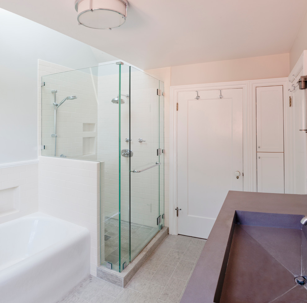 Photo of a small traditional bathroom in San Francisco with an integrated sink, recessed-panel cabinets, white cabinets, concrete benchtops, an alcove tub, a corner shower, ceramic tile, blue walls, ceramic floors and white tile.