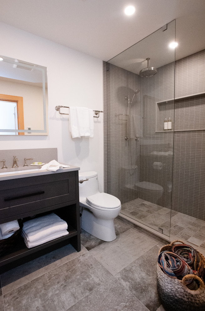 Mid-sized transitional bathroom in Other with shaker cabinets, grey cabinets, an open shower, a one-piece toilet, gray tile, mosaic tile, white walls, porcelain floors, with a sauna, an undermount sink, engineered quartz benchtops, grey floor, an open shower and grey benchtops.