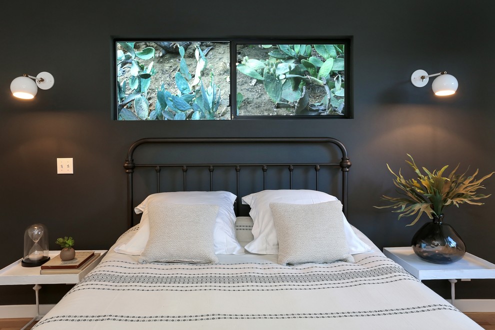 Bedroom - contemporary bedroom idea in Los Angeles with black walls