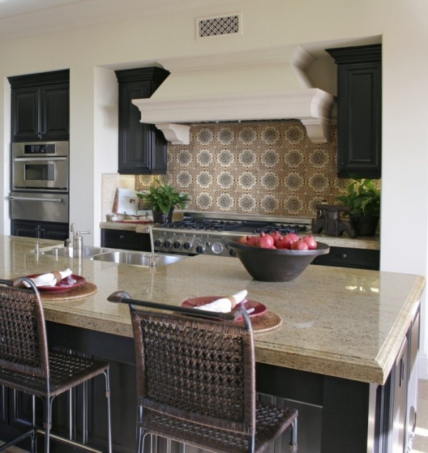 Eat-in kitchen - mid-sized rustic u-shaped eat-in kitchen idea in Orange County with recessed-panel cabinets, black cabinets, granite countertops, beige backsplash, stainless steel appliances and an island