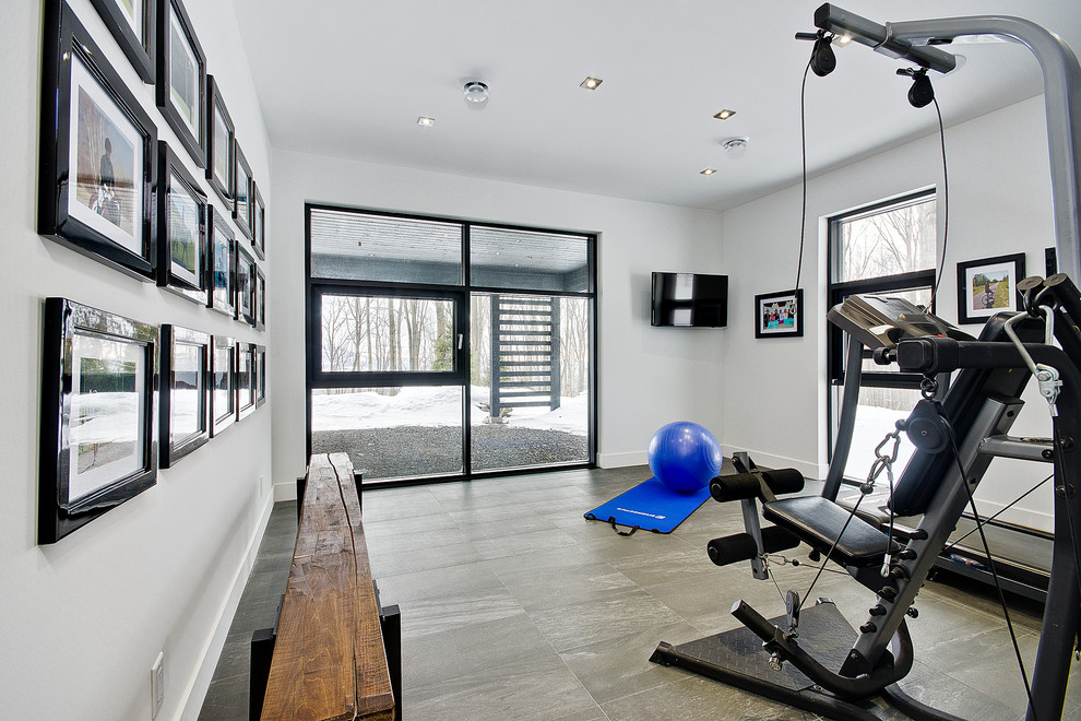 Design ideas for a contemporary multipurpose gym in Montreal with white walls and grey floor.