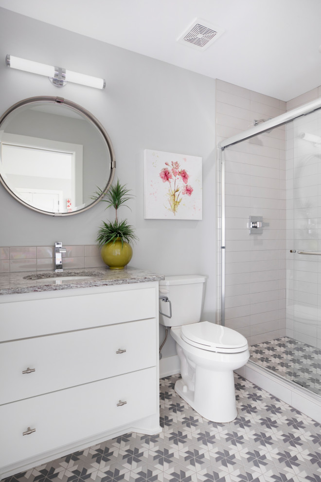 Large country 3/4 bathroom in Minneapolis with flat-panel cabinets, white cabinets, a two-piece toilet, gray tile, ceramic tile, grey walls, ceramic floors, an undermount sink, granite benchtops, multi-coloured floor, multi-coloured benchtops, a single vanity and a built-in vanity.