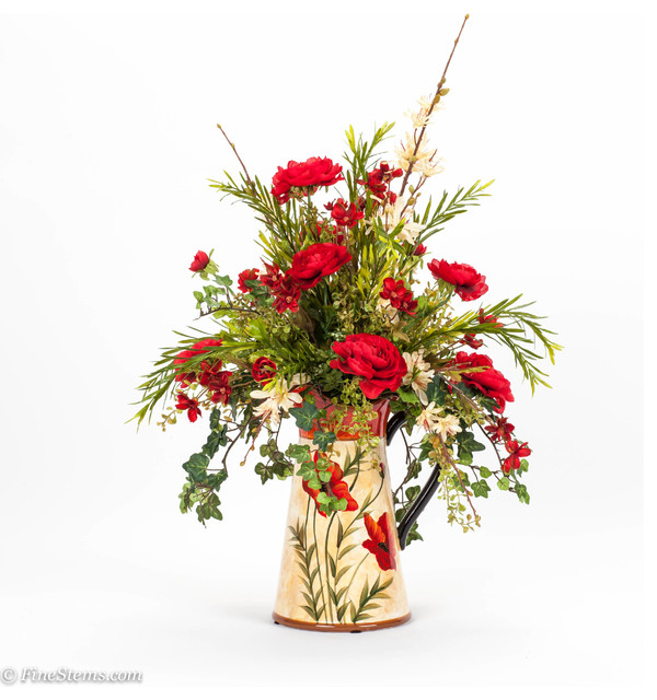 Red and cream silk floral arrangement in a poppy pitcher Traditional