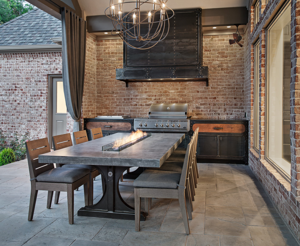 Patio kitchen - mid-sized transitional backyard stone patio kitchen idea in Houston with a roof extension